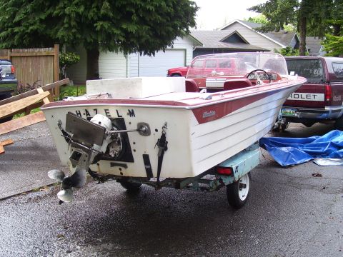 1979 Ford Bronco - A boat named HAZEL M is on a trailer, with a red pickup truck visible in the background.