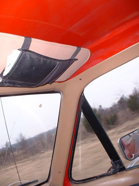 2006 Ford E350 - Interior view of a vehicle's cabin, looking out the side window at a blurred landscape.