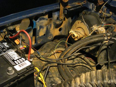 1985 Ford F-150 - Engine bay wiring and battery detail, showing electrical connections and components.