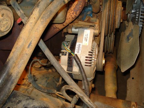 1985 Ford F-150 - This image shows an alternator and surrounding engine parts, not a specific vehicle model year.
