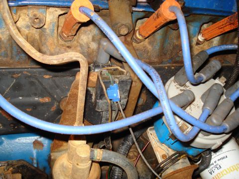 1985 Ford F-150 - Close-up view of engine wiring and distributor components, including spark plug wires and boots.