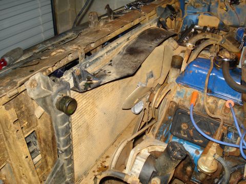 1985 Ford F-150 - Close-up view of an engine bay, focusing on the radiator and fan assembly.