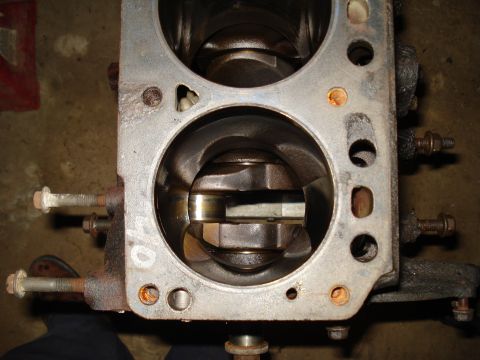 1991 Ford Bronco - Close-up view of an engine block's internal components, showing the crankshaft within the cylinders.