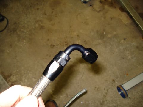 1967 Ford F-250 - Braided fuel line with a black 90-degree AN fitting.
