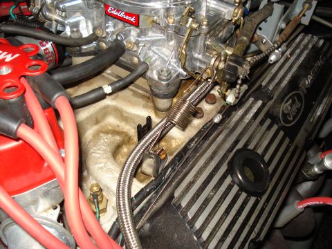 1967 Ford F-250 - Engine bay detail showing a Ford valve cover and carburetor assembly.