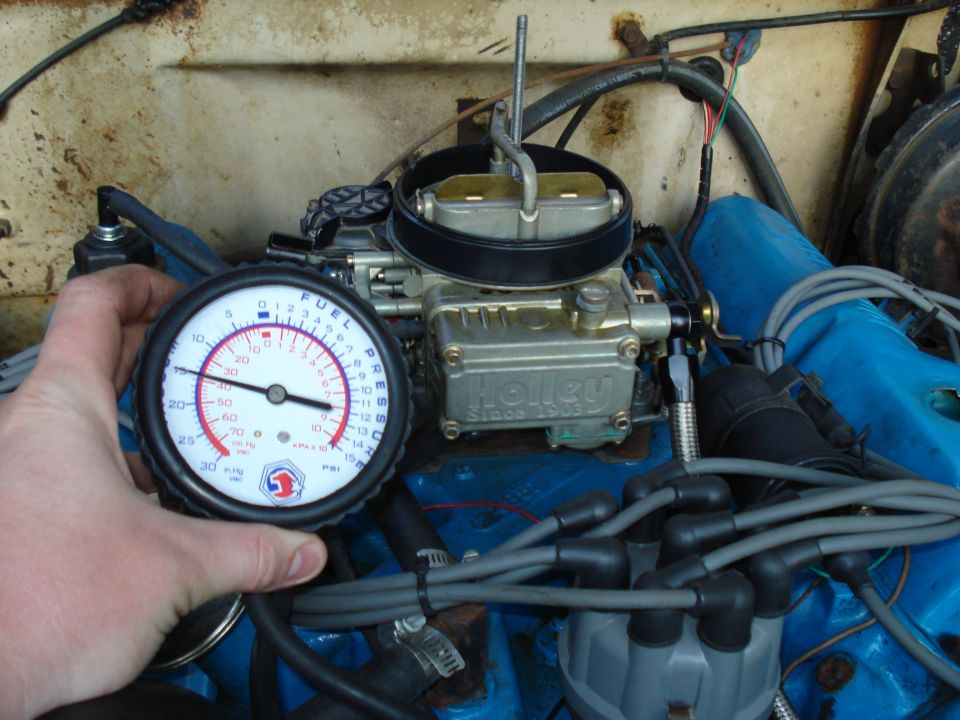 Holley carburetor with fuel pressure gauge attached to engine