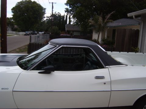 1973 Ford Ranchero - A white pickup truck with a black vinyl top is parked in a residential area. The number 500 is visible on the fender.