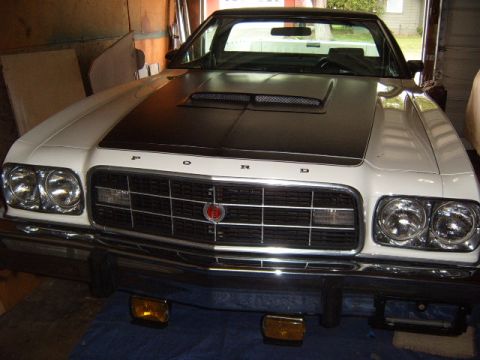 1973 Ford Ranchero - This 1973 Ford Ranchero features a distinctive black hood stripe and a prominent front grille.