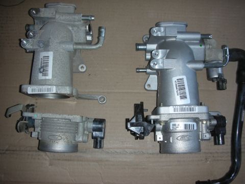 2004 Ford Crown Victoria - Comparison of two Ford throttle bodies, possibly for different engine applications.