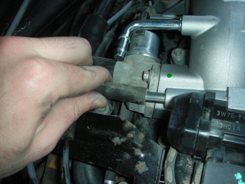 2004 Ford Crown Victoria - Close-up of engine components, possibly related to an intake manifold modification.