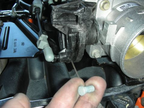 2004 Ford Crown Victoria - A close-up view of engine components, focusing on the throttle body and intake manifold.