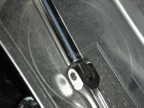 2004 Ford Crown Victoria - A 5/16 wrench is shown resting on a textured surface, possibly during a repair or installation.