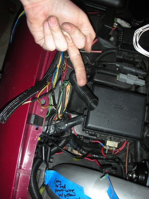 1992 Ford Crown Victoria - Wiring harness and fuse box with handwritten notes on blue tape.