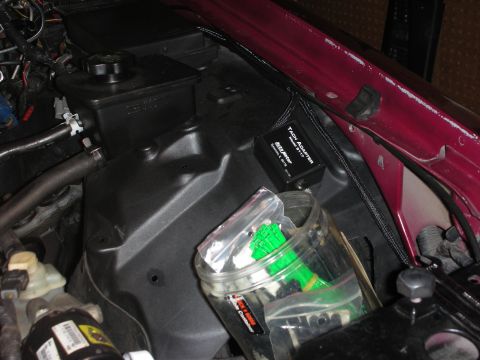 1992 Ford Crown Victoria - Close-up view of engine bay components, including a tach adapter and various electrical connections.