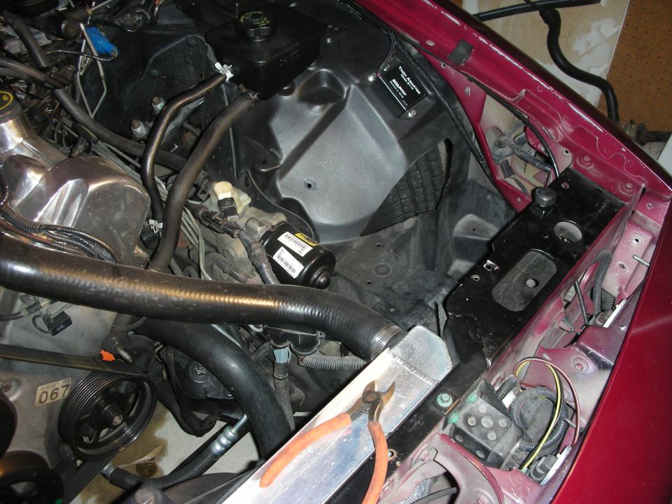 Maroon 1992 Ford Crown Victoria engine bay with a new radiator and intercooler components