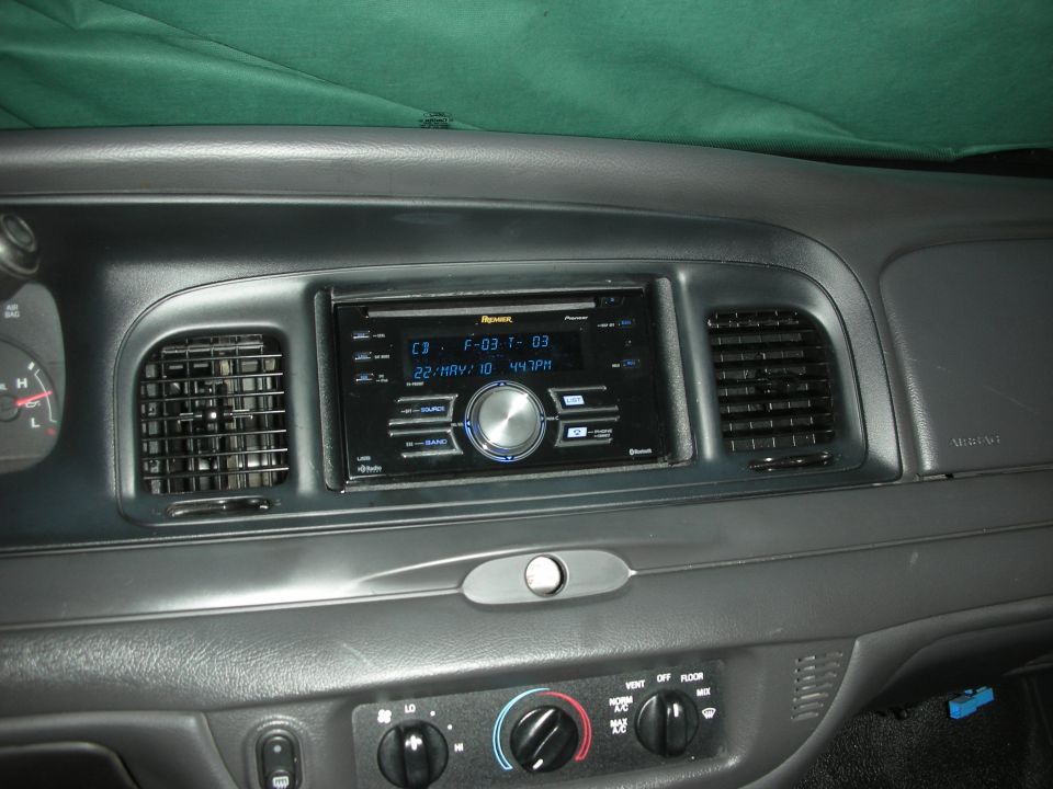 Gray dash with Pioneer Premier CD stereo, center vents and rotary HVAC knobs