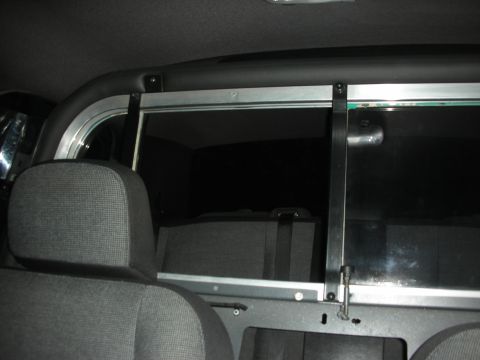 2004 Ford Crown Victoria - View of the interior partition and rear seats, looking through the rear window.