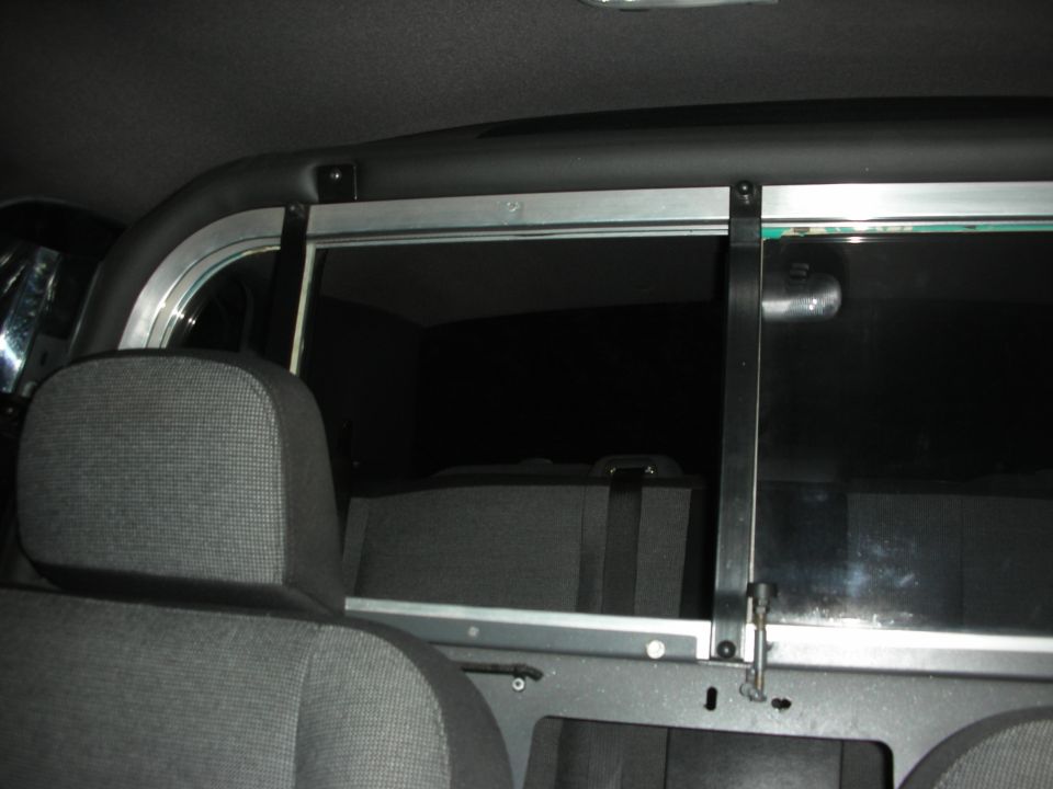 Interior partition with seats and dark windows