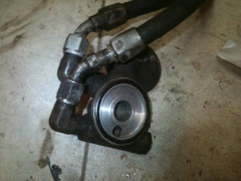 1989 Ford Bronco - Oil filter housing with hoses, likely from an engine bay.