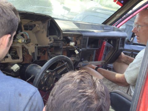 1969 Ford F-250 - Interior view of a disassembled dashboard with exposed wiring and a steering wheel.
