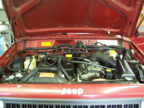 1991 Jeep Comanche - Engine compartment of a 1991 Jeep Comanche, showing the engine and associated components.