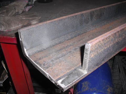 1991 Ford Bronco - A metal beam with a welded corner is shown, exhibiting signs of rust and grinding.