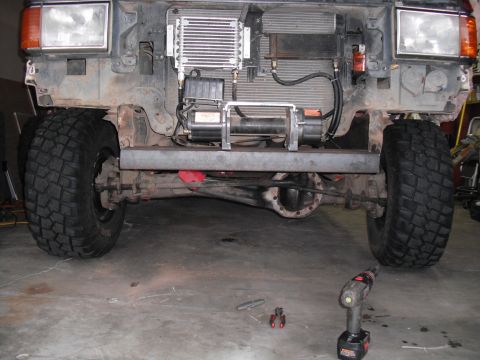 1991 Ford Bronco - The front end of a truck, possibly from the 1980s, is shown with a winch installed and the radiator exposed.