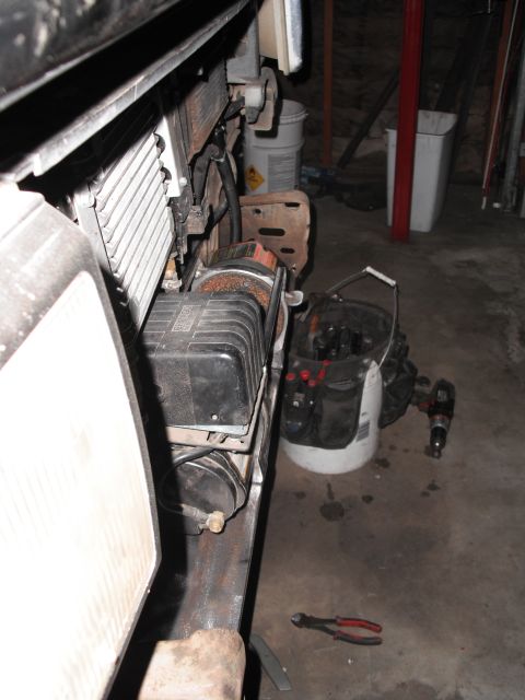 1991 Ford Bronco - Close-up view of a winch and radiator assembly, likely part of a vehicle's front-end components.