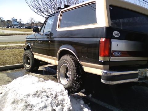 1990 Ford Bronco - This Ford Bronco has a two-tone paint scheme and appears to be from the late 1980s.