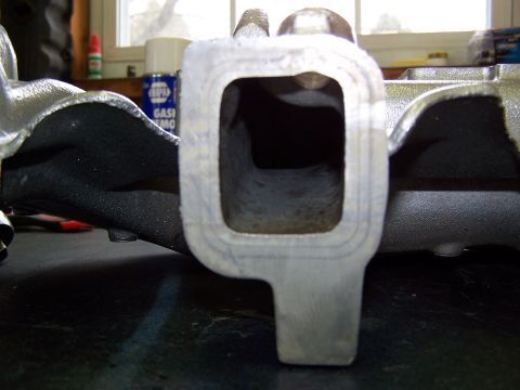1991 Jeep Comanche - Close-up of an intake manifold, revealing its internal structure and casting details.