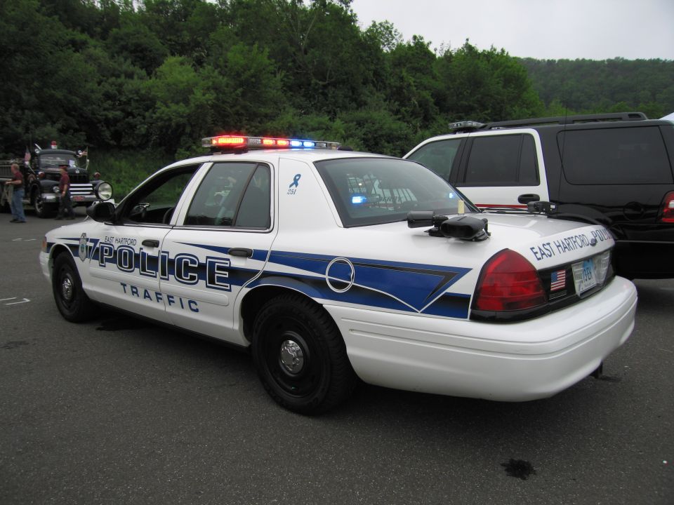 White East Hartford Police Traffic Ford Crown Victoria, rear three-quarter view