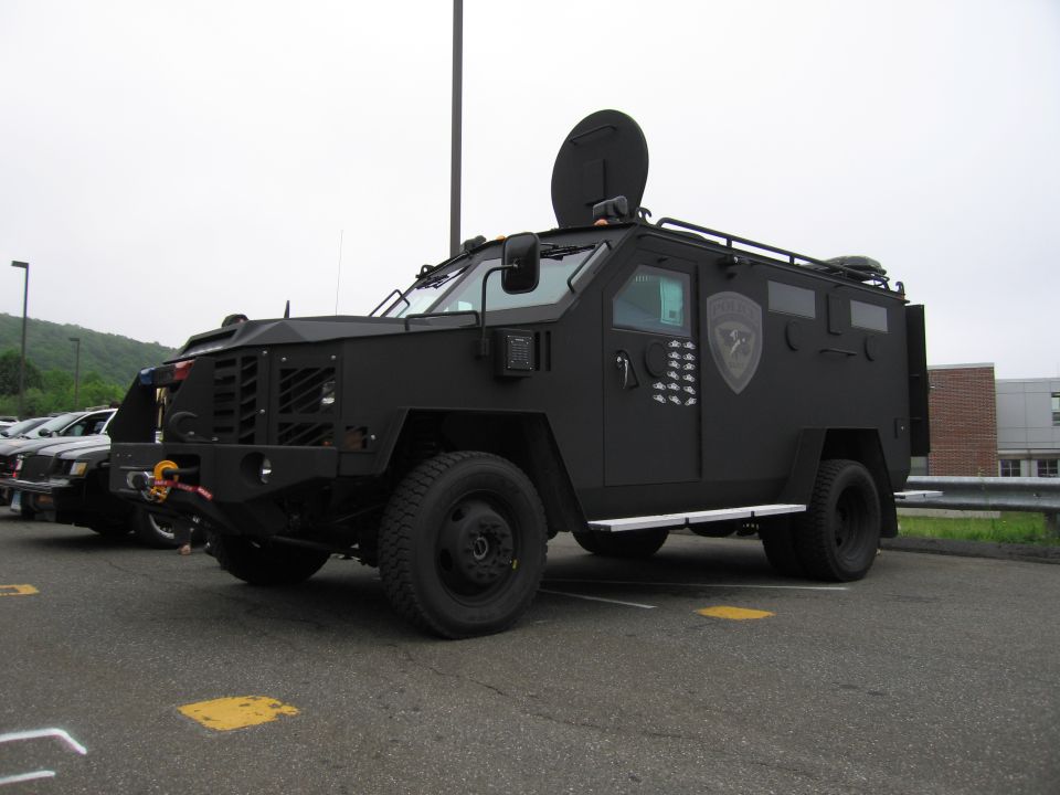 Black Lenco BearCat-style armored SWAT truck, front three-quarter view
