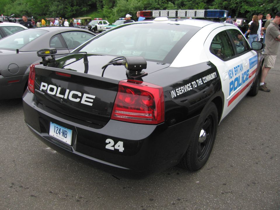 Black and white Dodge Charger New Britain Police cruiser 24, rear three-quarter view