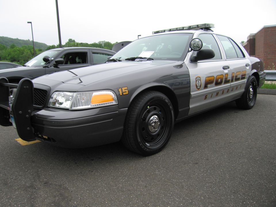 Gray Ford Crown Victoria police interceptor with Simsbury Police markings and light bar