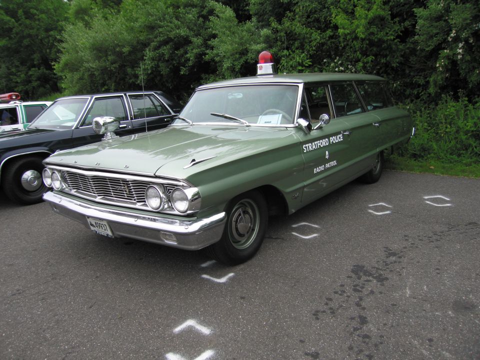 Green 1960s station wagon marked Stratford Police Radio Patrol