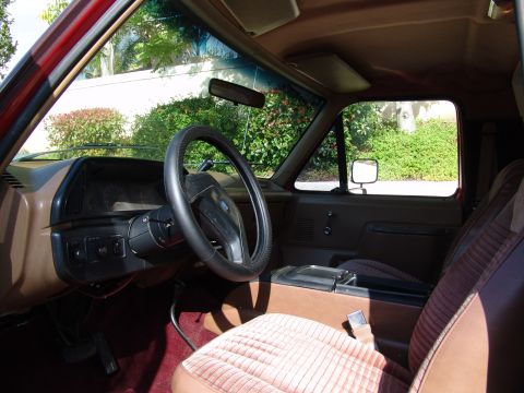 1991 Ford Bronco - Interior view of a 1991 Ford Bronco, brown upholstery and dashboard details.