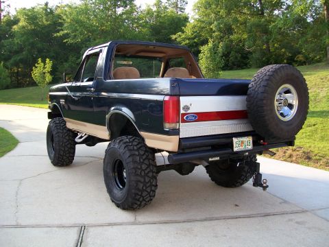 1990 Ford Bronco - This lifted 1990 Ford Bronco features oversized tires and a rear-mounted spare wheel.