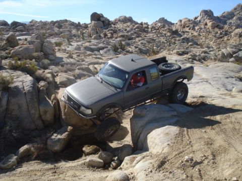 1997 Ford Ranger - This pickup truck is navigating a challenging rocky terrain.