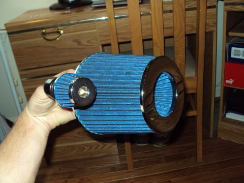 1993 Ford Probe - A blue cone air filter with chrome trim is held up for inspection.