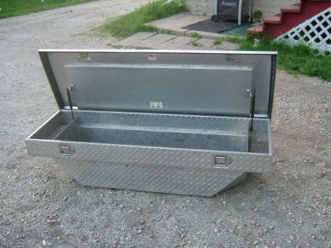 1991 Toyota Tacoma - Diamond plate aluminum toolbox for a truck bed, shown open.