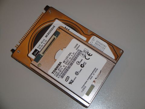 1993 Ford Taurus - Computer hard drives are shown, with a Toshiba drive placed on top of a Seagate drive.