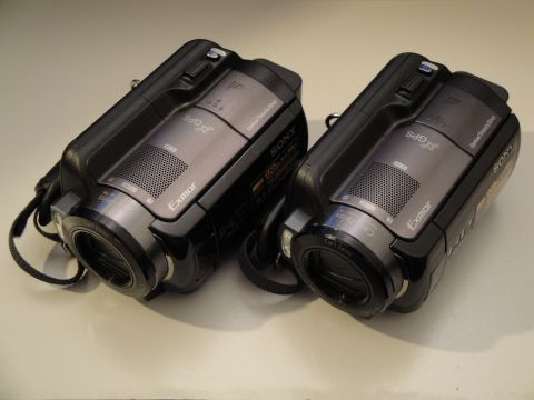 1993 Ford Taurus - A pair of Sony Handycam camcorders, each Exmor lenses and GPS capabilities, are displayed side-by-side.