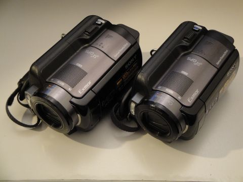 1993 Ford Taurus - Two Sony camcorders are placed side-by-side on a light-colored surface.