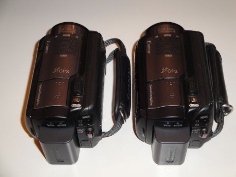 1993 Ford Taurus - Two camcorders are shown side-by-side against a white background.