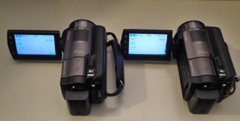 1993 Ford Taurus - Two camcorders are shown side-by-side with their screens open, displaying menu options.