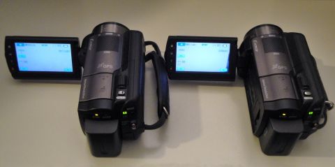 1993 Ford Taurus - Two camcorders are displayed side-by-side with their screens open, showing menu options.