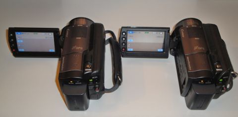 1993 Ford Taurus - Two camcorders are displayed side-by-side, each with its screen open, on a plain white background.