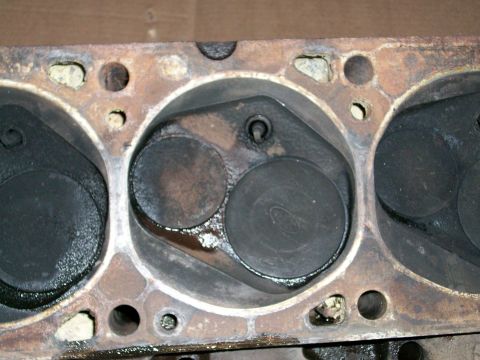 1973 Ford Ranchero - Close-up of an engine cylinder head with valves and combustion chambers.