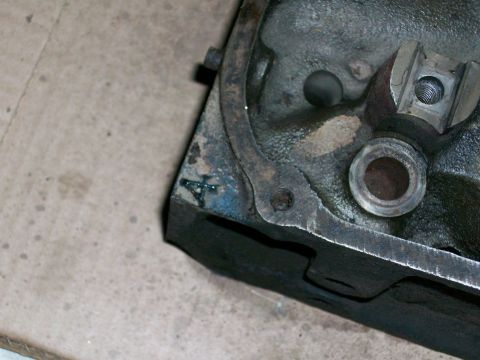 1973 Ford Ranchero - A close-up view of a weathered engine component shows a hand-painted number 4 on its surface.