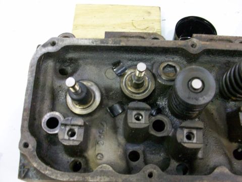 1973 Ford Ranchero - This is a close-up view of an engine's cylinder head, showing internal components like valves and springs.